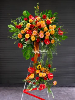 Rực rỡ và đẳng cấp cùng Kệ Hoa Khai Trương Tropical Sang Trọng kết hợp hồng môn đỏ và cam spirit đón tài lộc. Giao nhanh 60p tại TPHCM, đặt ngay hôm nay!